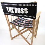 Chair with filmstrip printed seat and "the boss" written on back