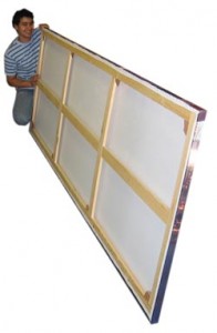 Man holding a large photo canvas printing