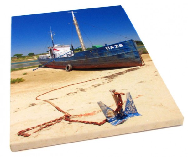 A boat standing on a beach on a canvas print