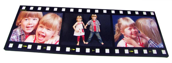 Canvas print with filmstrip montage frame displayed two children