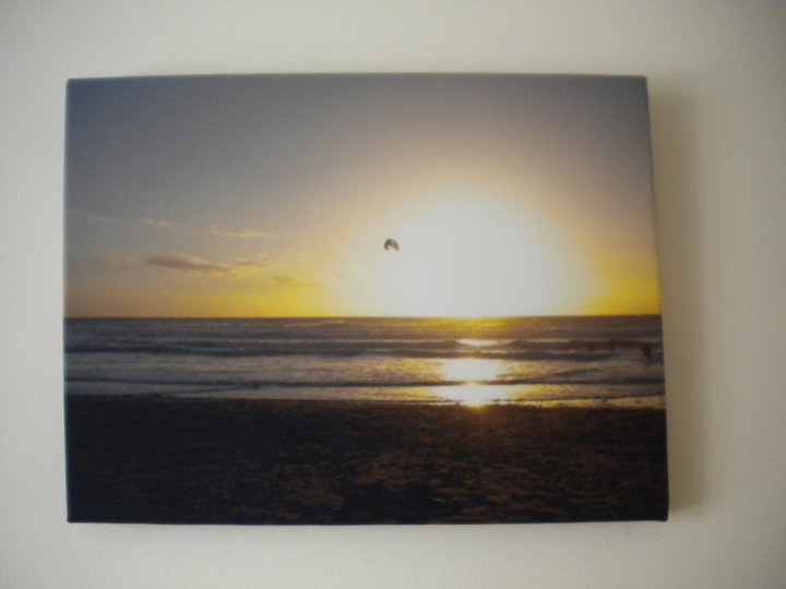 Sunset on a canvas print hanging on a wall