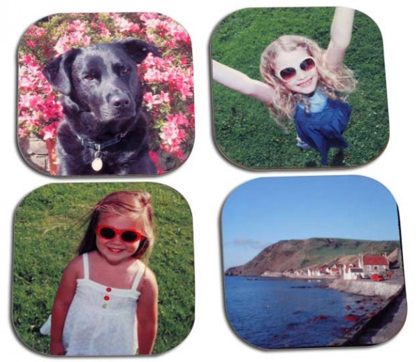 Two little girl, a dog and houses on the coast on four coasters