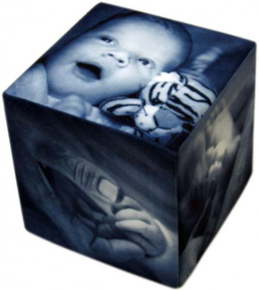 Black and white baby photos on a photo cube