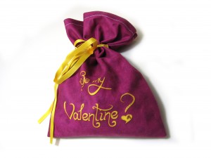 Purple drawstring pouch with "be my valentine?" written on it