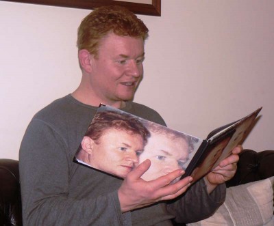 open photo book A man opening a photo book