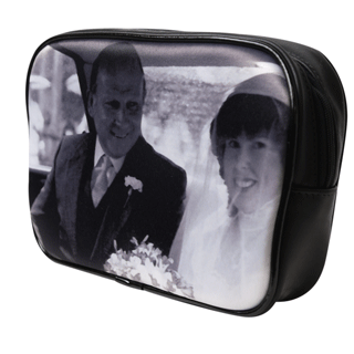Black and white wedding photo on a black make up bag