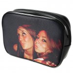 A black make up bag with a photo of two teenagers as unique birthday gift ideas