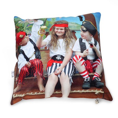 A personalised photo cushion with a photo with children dressed up as pirates