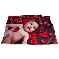 Photo blanket with an image of a baby and red rose petals