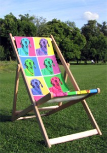 Deckchair standing on grass with an andy warhol printed seat