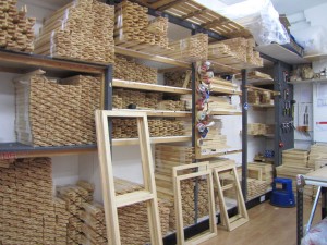 Room full of canvas frames on shelves