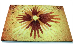 Four hand prints on yellow background on a photo canvas
