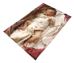 Baby lying in a bed on a blanket