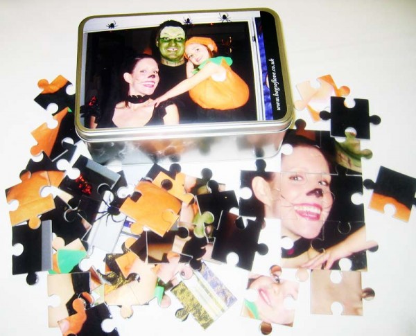 Puzzle pieces and tin box with the same image