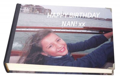 Young girl on a boat on the cover of a photo album