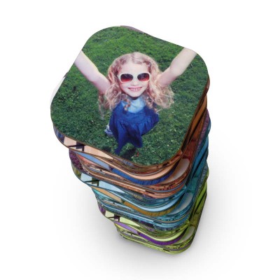 A stack of coasters with photos printed on them