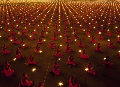 monks-praying-candles