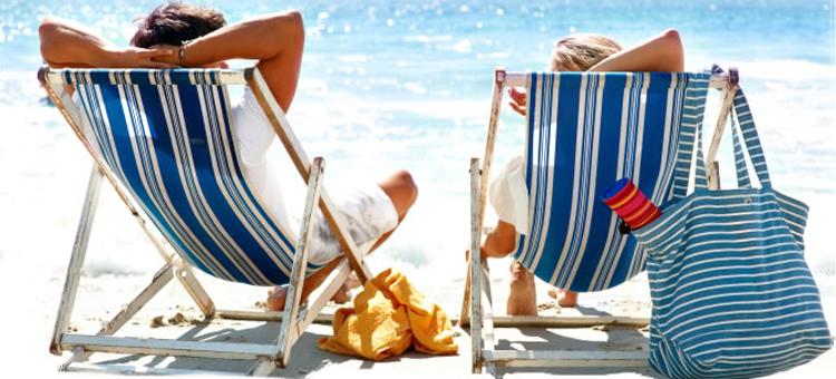 man-and-woman-relaxing-on-deckchairs