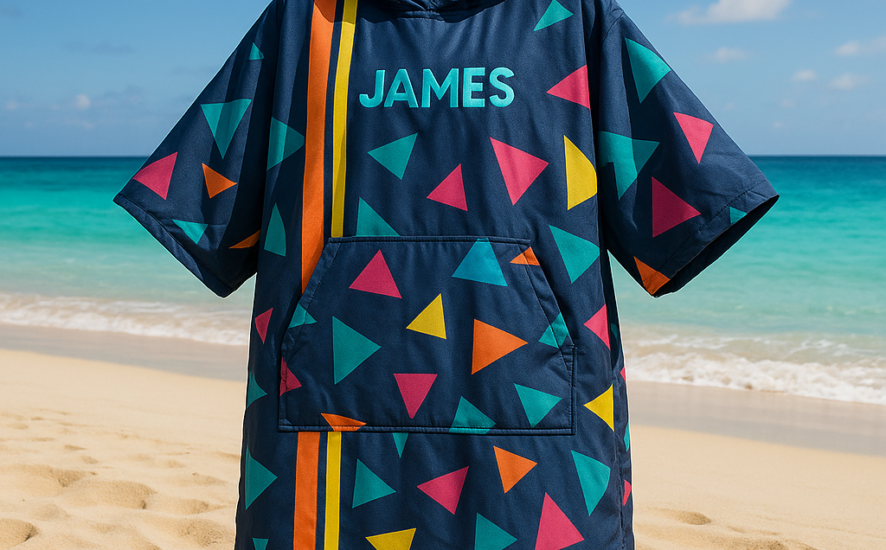 A custom-designed waterproof changing robe on a beach with a sunny ocean view.